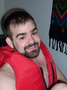 This is my goofy husband in nothing but a child's size lifejacket.  Quite humerous!